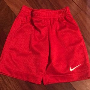 Red Nike mesh shorts.  3-4 yrs